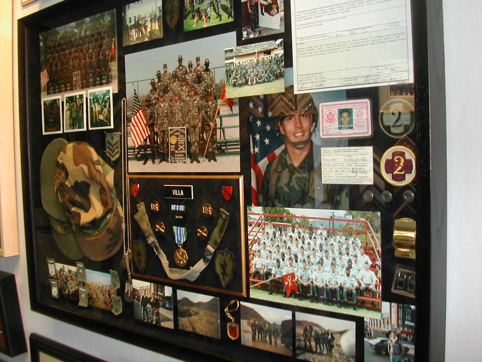Large custom military career shadowbox with photographs, medals, uniform pieces, and documents