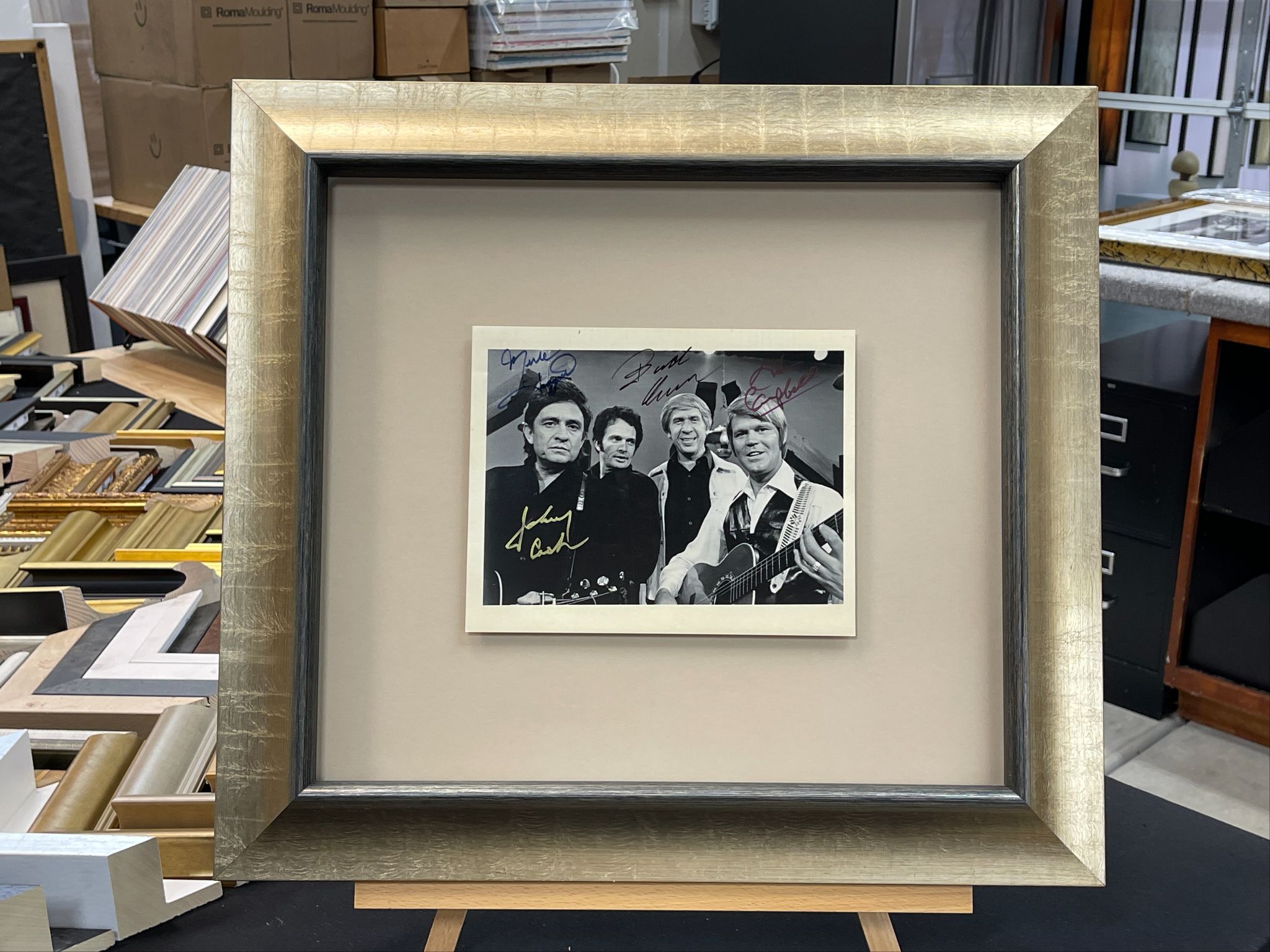 Signed country music group photograph in a custom silver frame